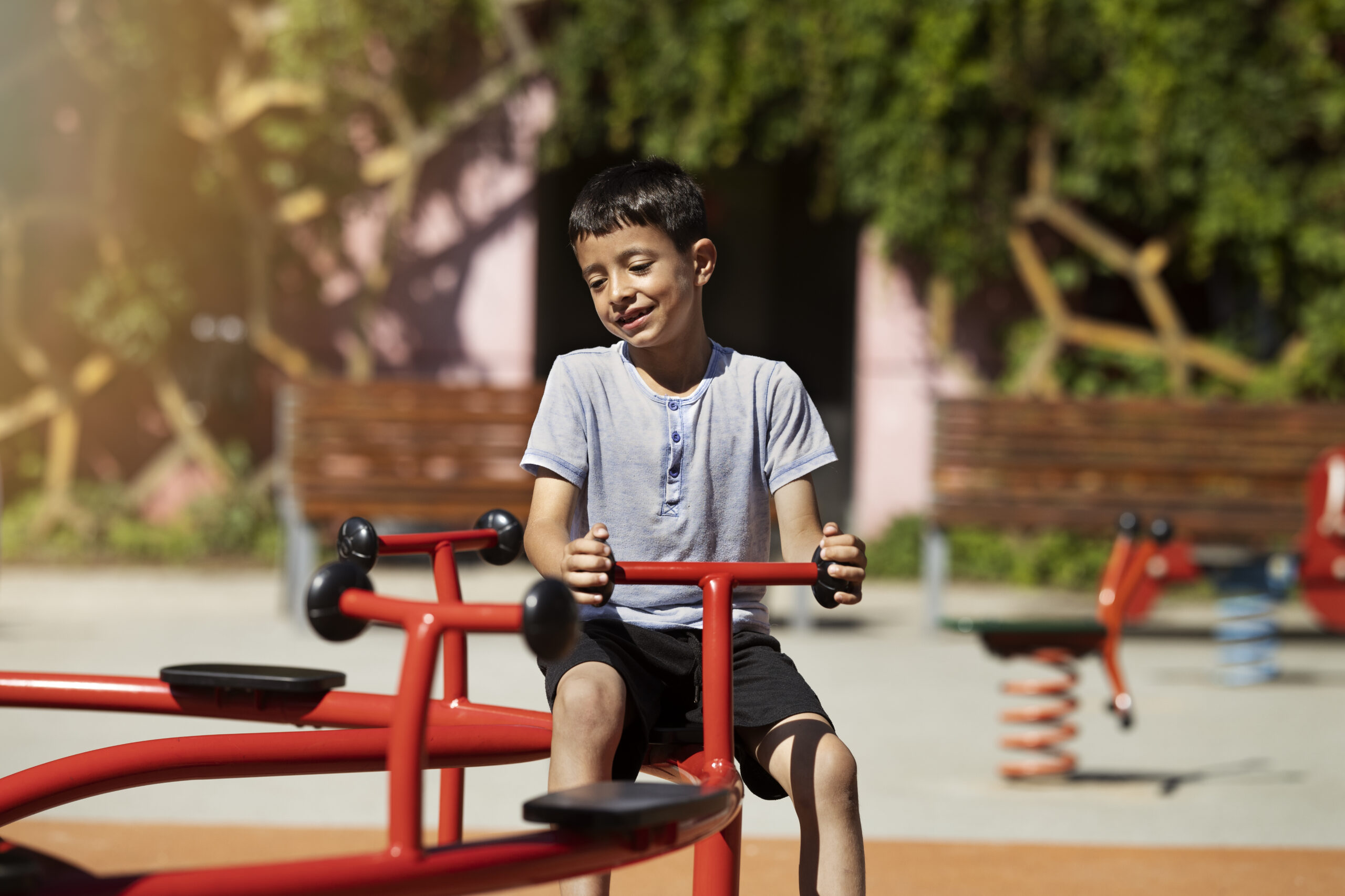 young boy having fun playground